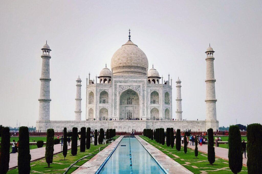 This is the front view of Taj Mahal on cloudy day and this view of taj mahal has vast amount of greenery.